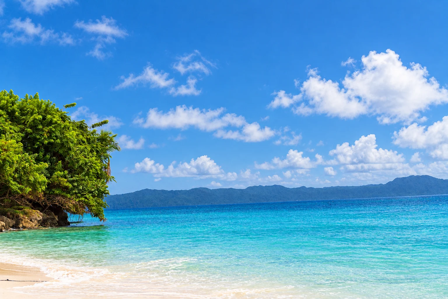 Clear water beside a wooded coastal outcrop — Cayo Levantado, AI-enhanced archival photograph