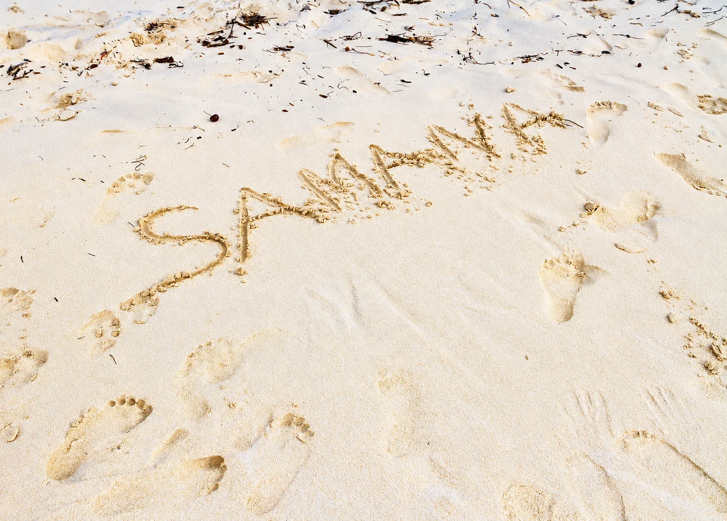 Samaná written in the beach sand — Cayo Levantado, AI-enhanced archival photograph